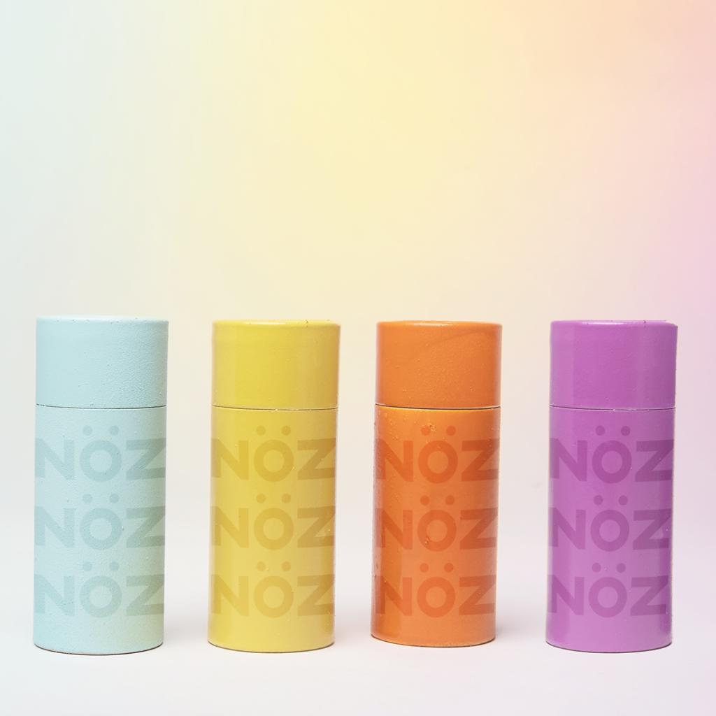 retractable sunscreen stick swith lids on. ordered blue, yellow, orange and purple